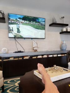 sitting with feet up in front of the tv